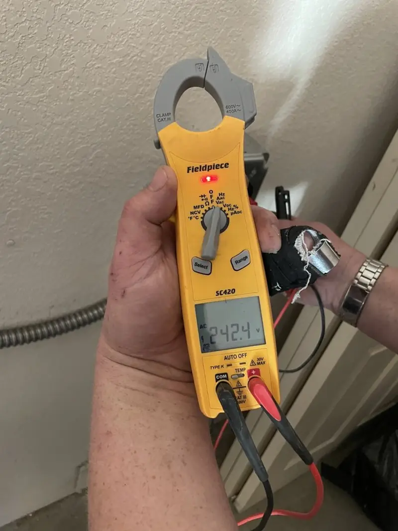 Voltage testing with clamp meter during Circuit Breaker Repair in Burnsville